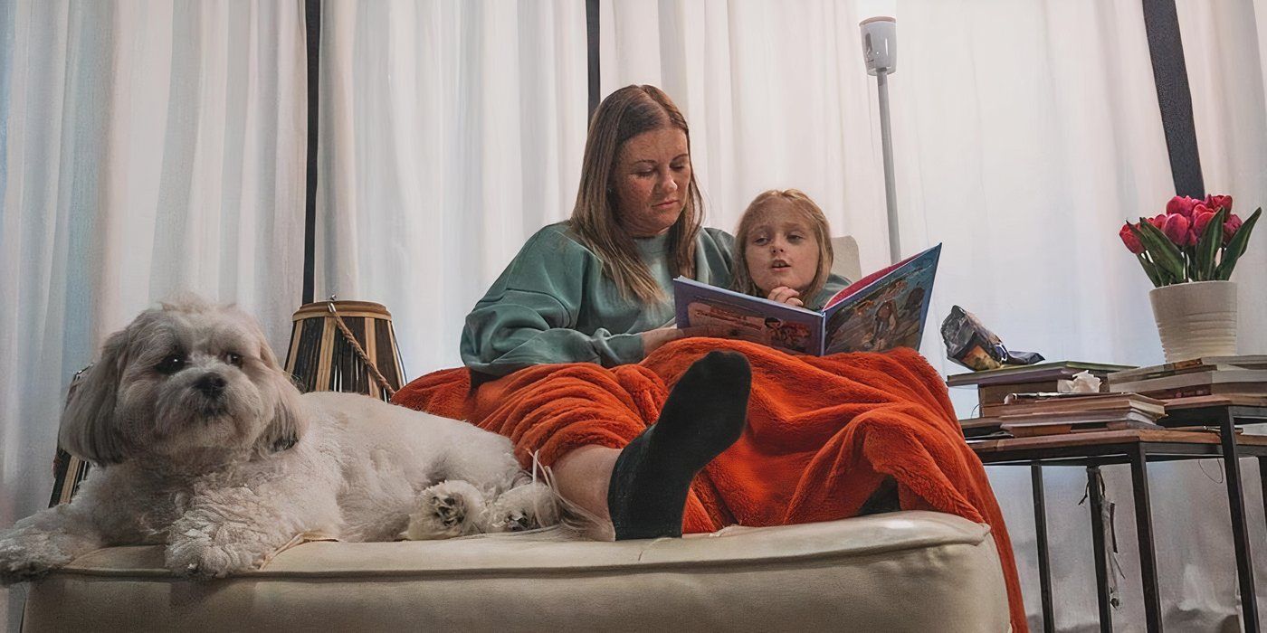 OutDaughtered Danielle with one of the quints reading 