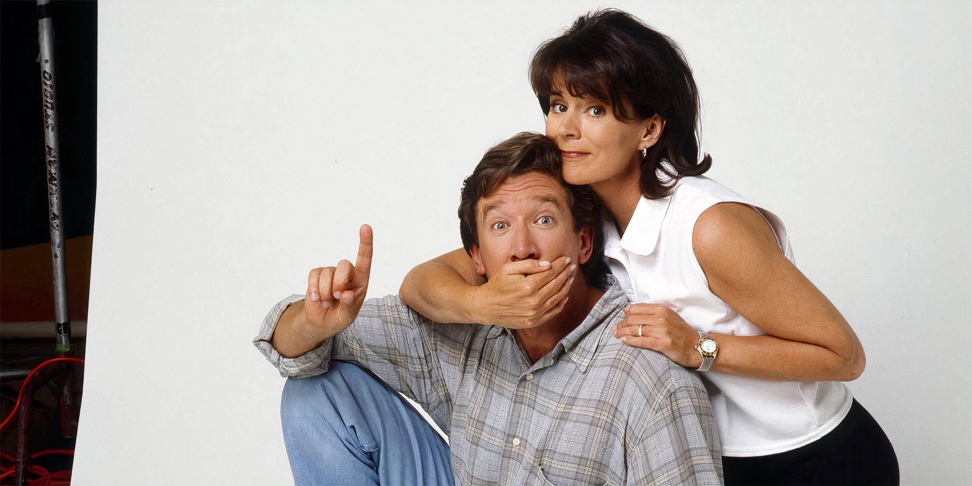 Patricia Richardson and Tim Allen posing for Home Improvement