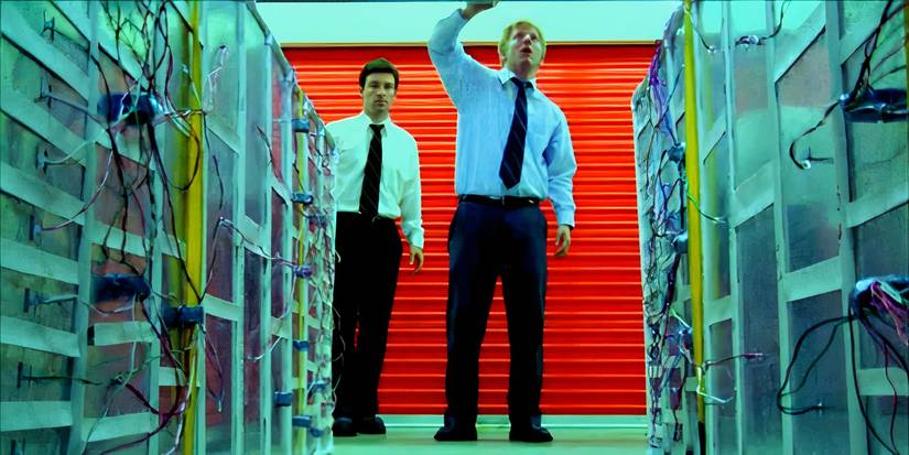 Two men walking into a storage facility in Primer