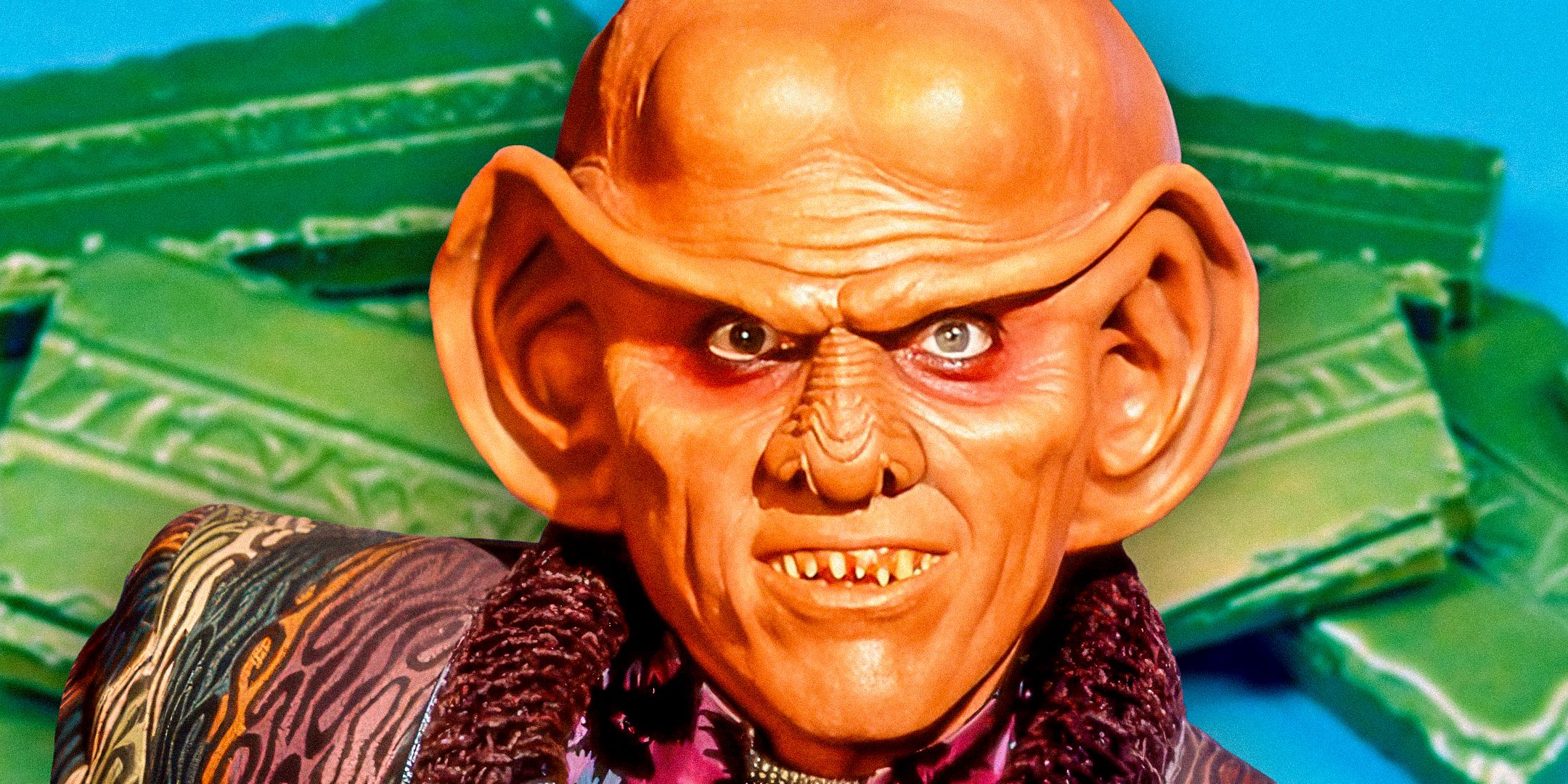 Armin Shimerman as Quark from Star Trek: Deep Space Nine with bars of latinum in the background