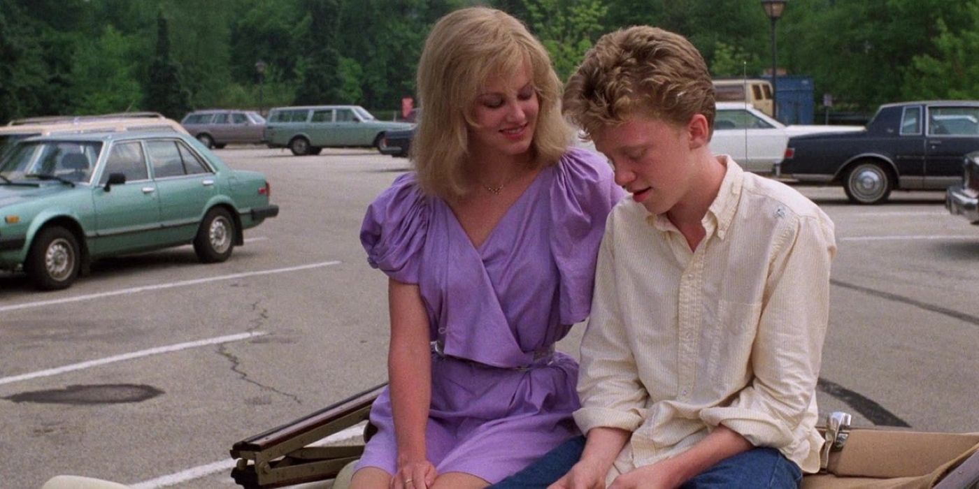 Haviland Morris As Caroline & Anthony Michael Hall As Ted Sitting on a Car In Sixteen Candles