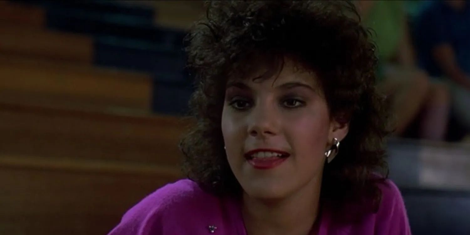 Liane Curtis As Randy Sitting on the Bleachers In Sixteen Candles