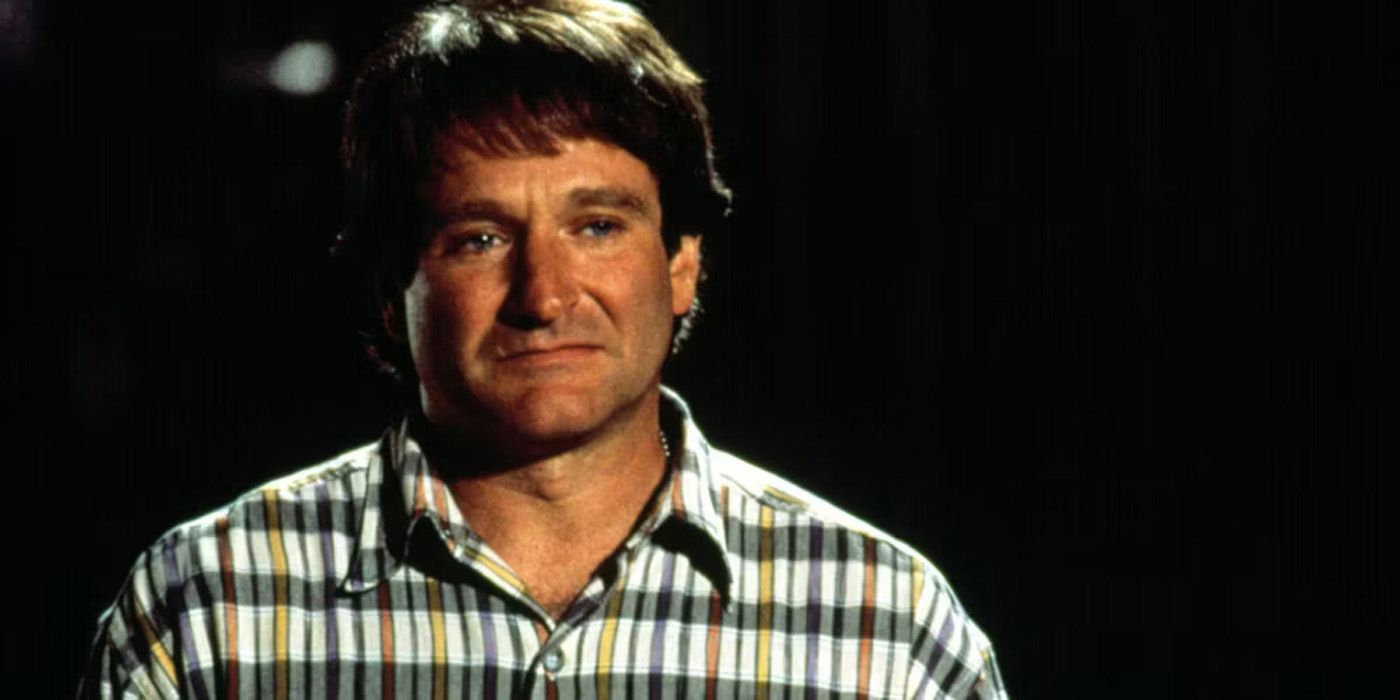 Robin Williams como Daniel Hillard parecendo triste em Mrs Doubtfire