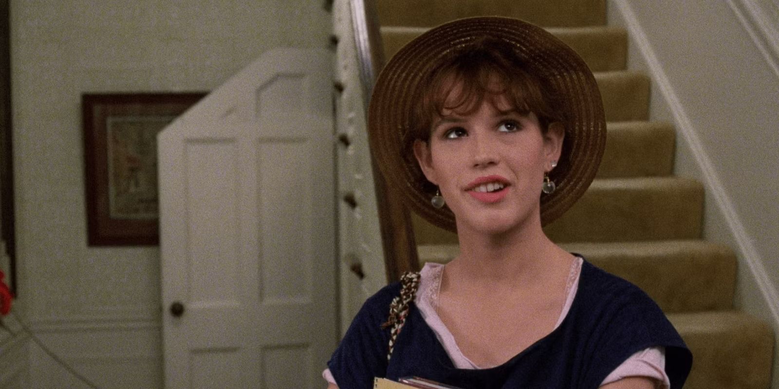 Molly Ringwald bites her lip and glances up. 