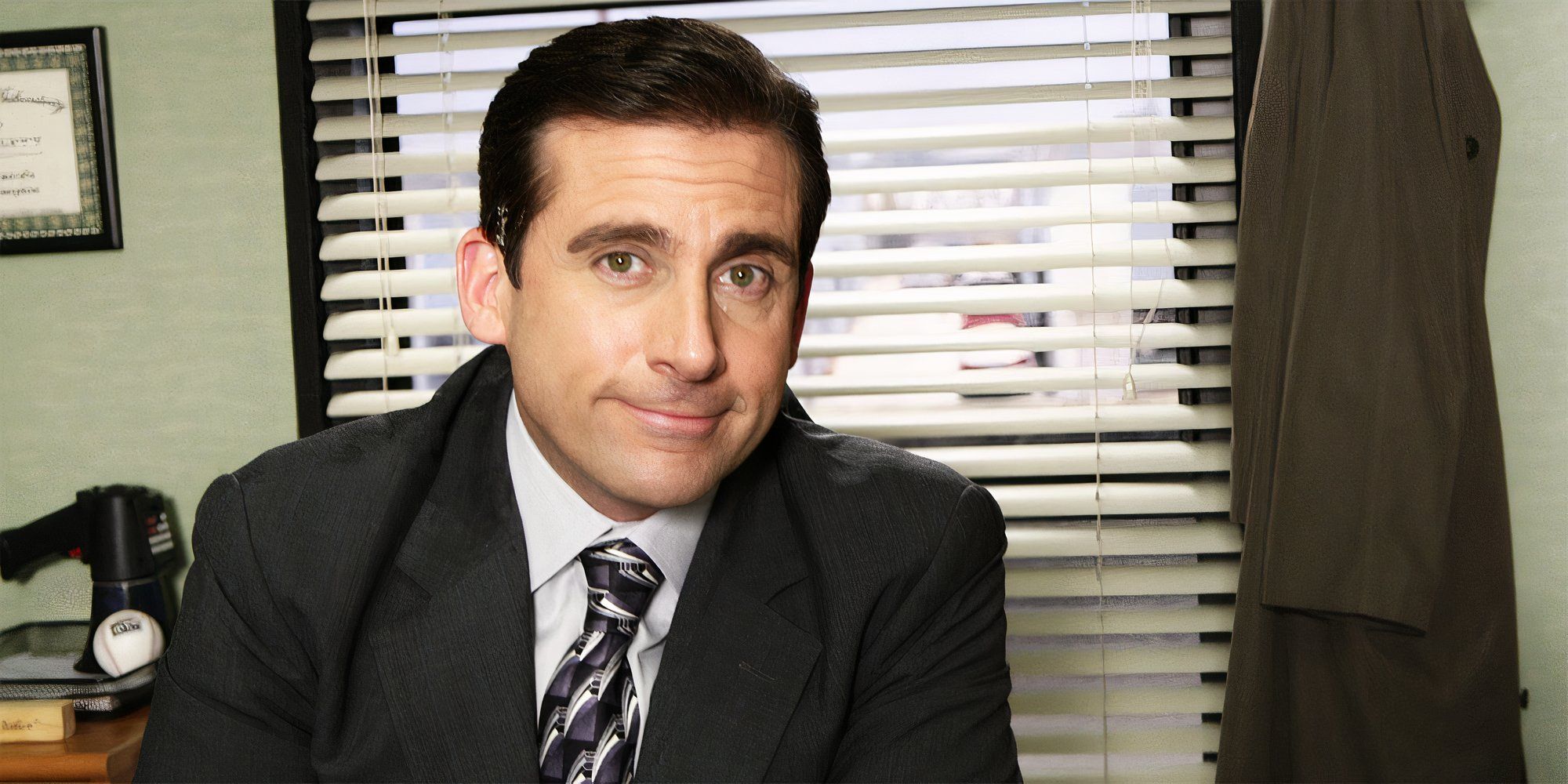 Steve Carrell as Michael Scott smiling to camera in The Office