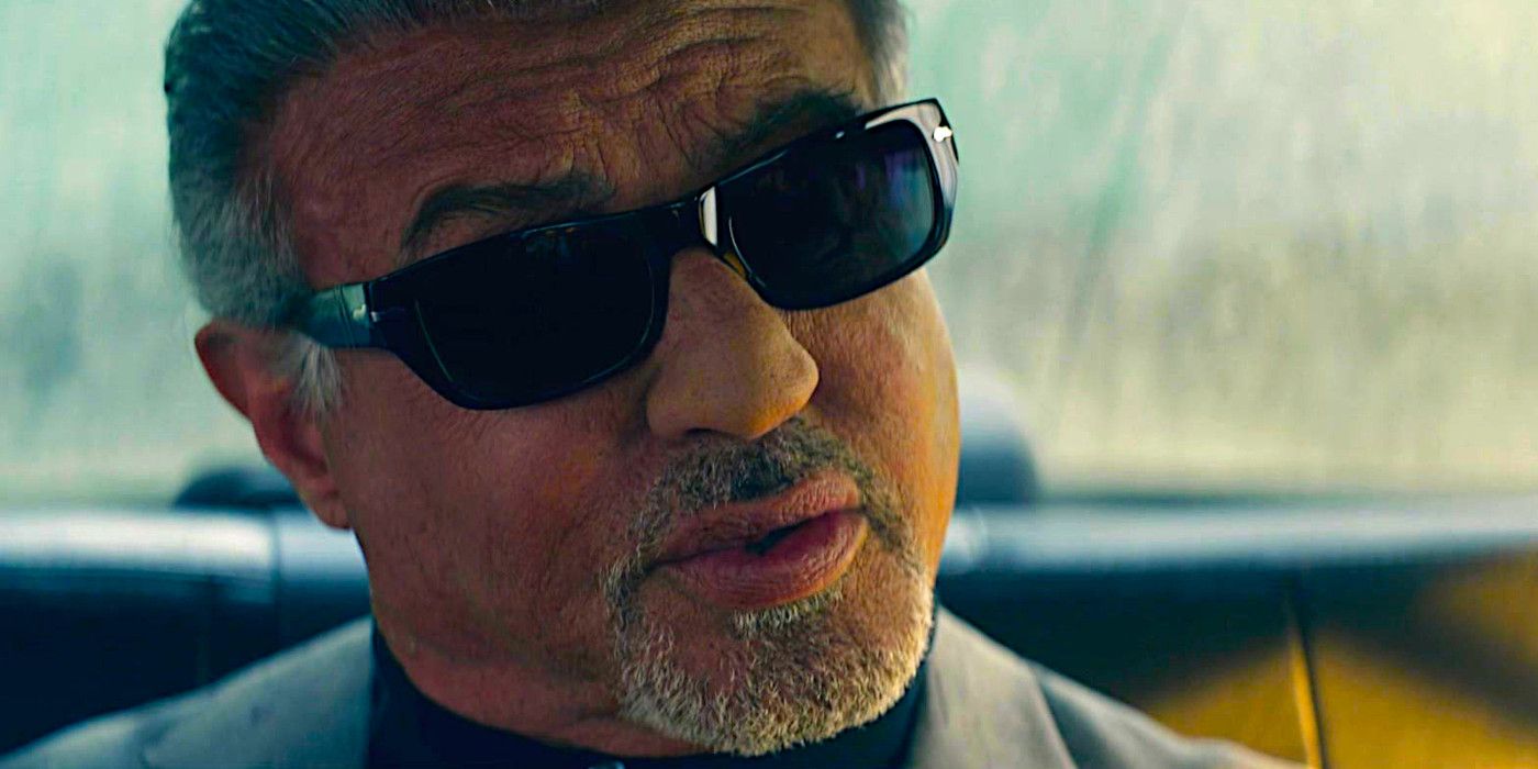 Sylvester Stallone gives a stern talking to while wearing sunglasses in a scene from Tulsa King