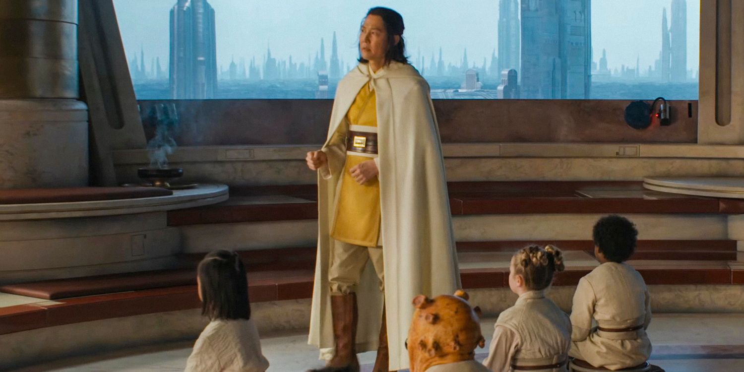 Jedi Master Sol (Lee Jung-jae) walks among a group of sitting Jedi Padawans in the Temple on Coruscant in The Acolyte season 1 (STAR WARS)