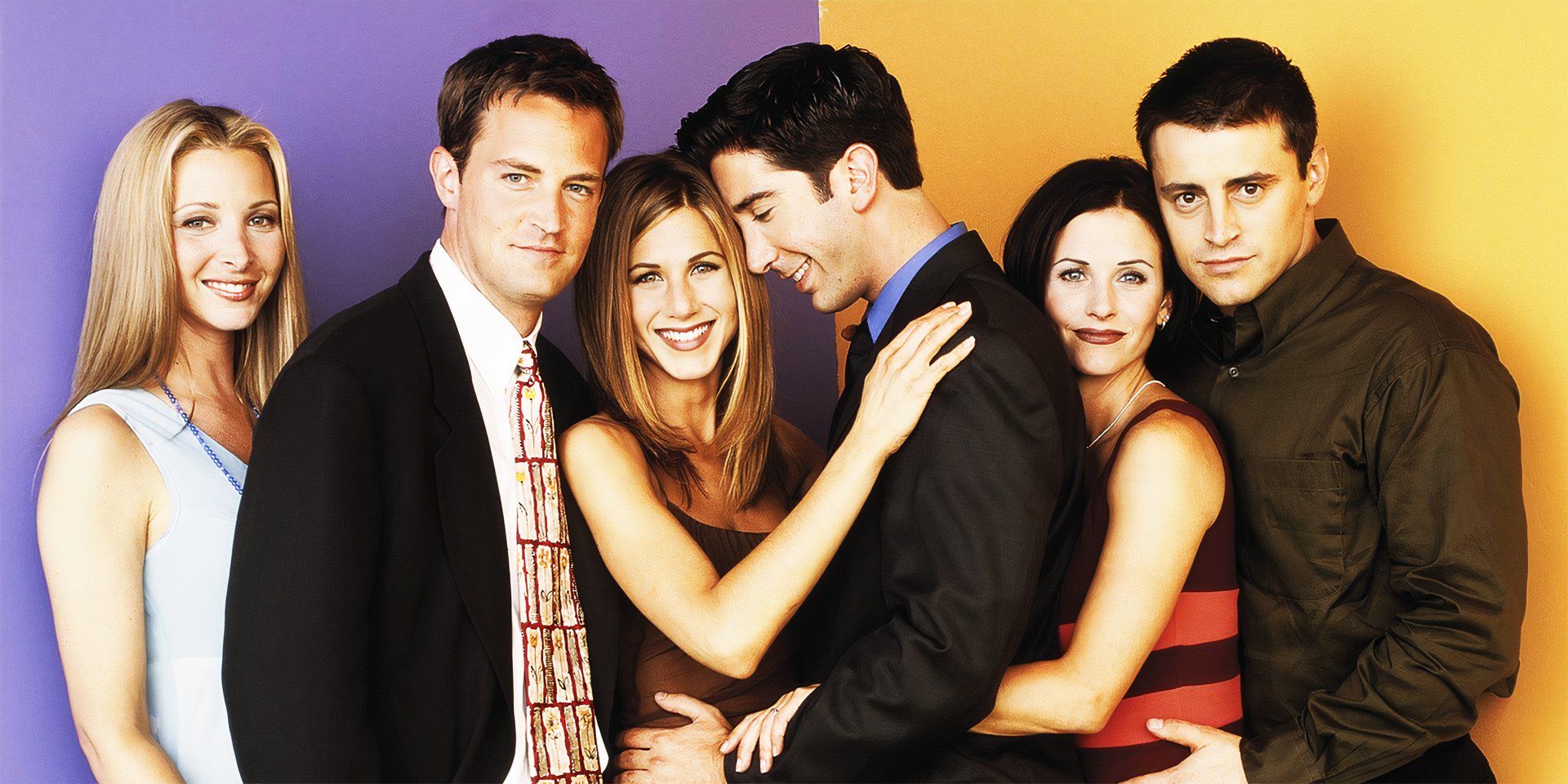 The cast of Friends standing together in a promotional photo