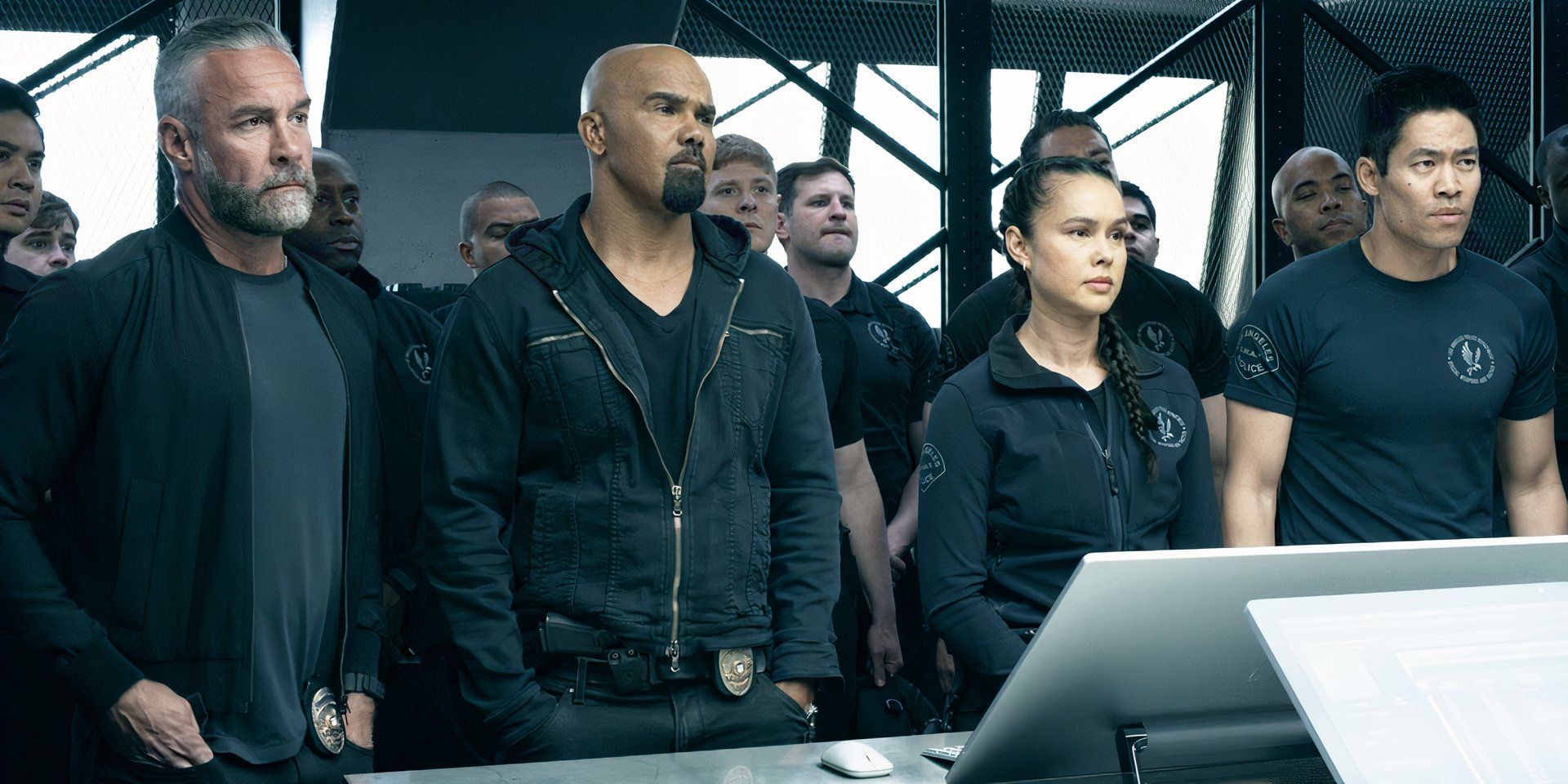 The cast of SWAT season 6 standing together in a photo for the finale