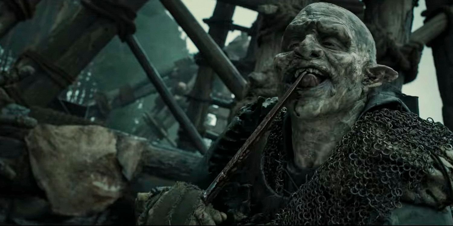 An orc licking a dagger in The Lord of the Rings: The Rings of Power season 2