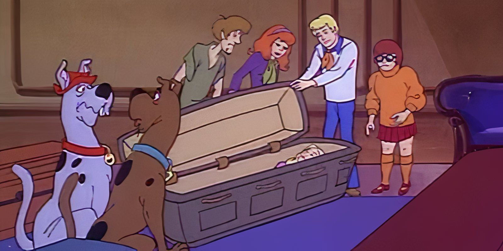 The Scooby gang opening a coffin while Scooby and his cousin watch in a Scooby Doo animated series