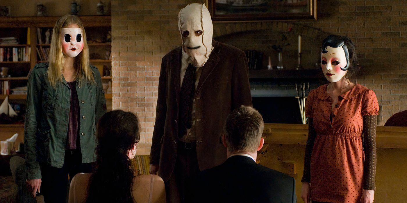 Three masked killers decide what to do with their victims in The Strangers 