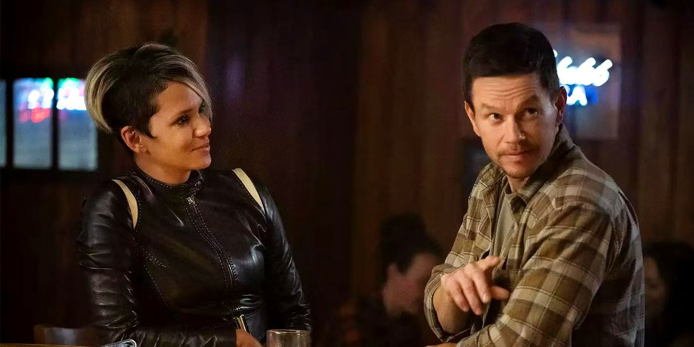Halle Berry leans against a bar and looks at Mark Wahlberg as he orders a drink in The Union