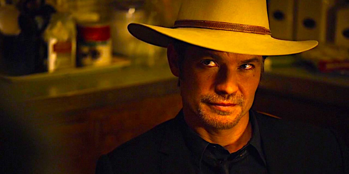 Timothy Olyphant peers upward in an intimidating way in a scene from Justified
