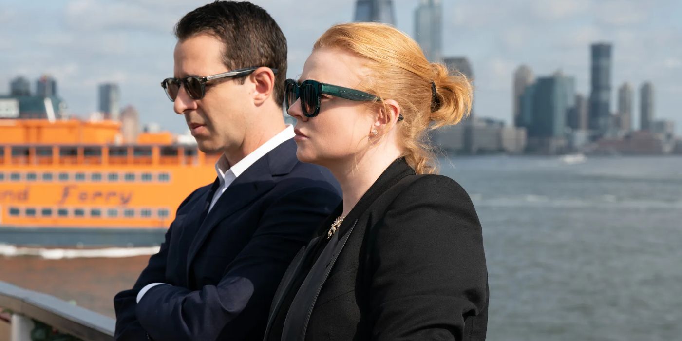 Kendall (Jeremy Strong) and Shiv (Sarah Snook), dressed in black, leaned against a bridge one after the other