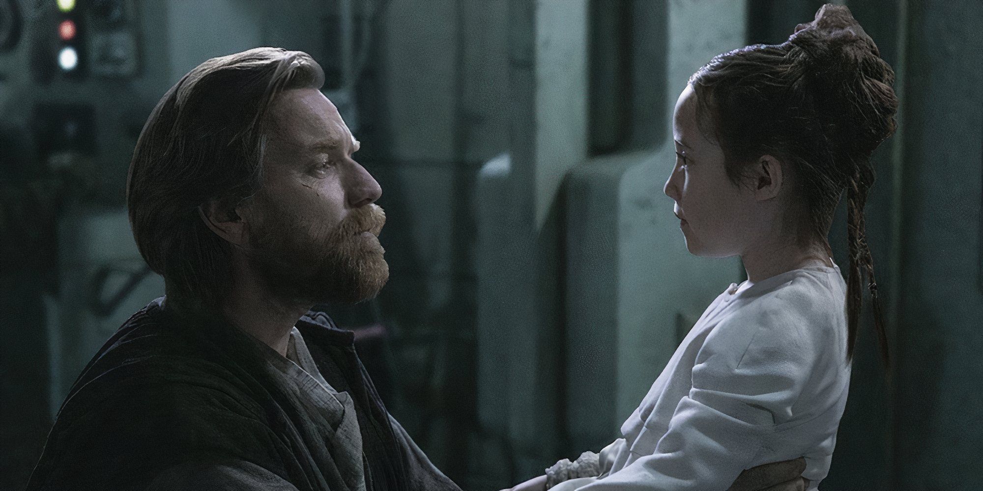 Ewan McGregor as Obi-Wan Kenobi looking into the eyes of Vivien Lyra Blair as Princess Leia in Obi-Wan Kenobi