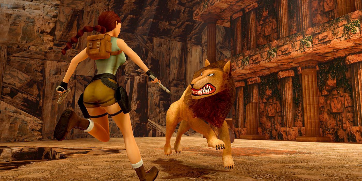 Lara Croft running into battle with a snarling lion
