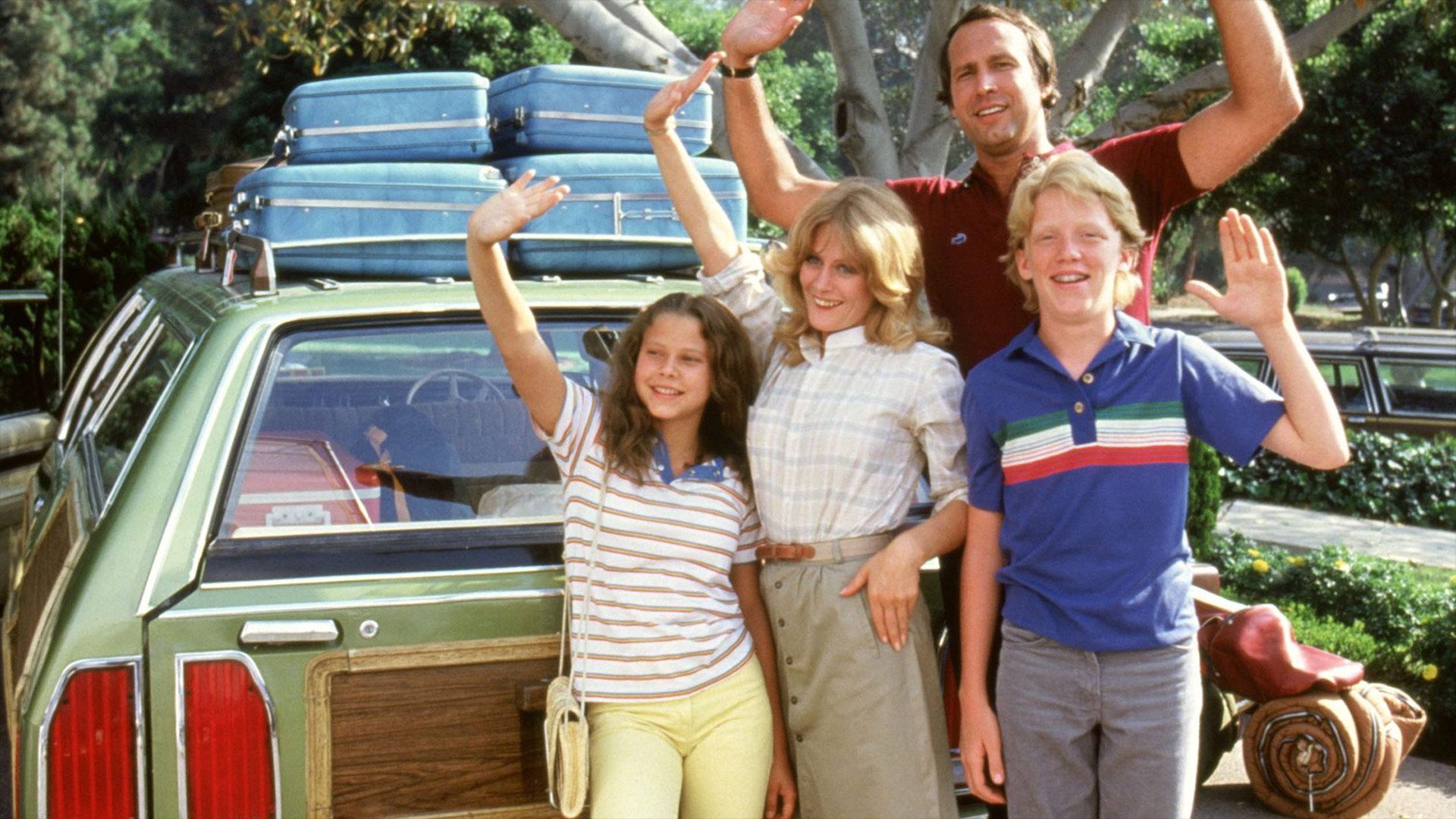 The Family In National Lampoon's Vacation Standing By Car & Waving.jpg
