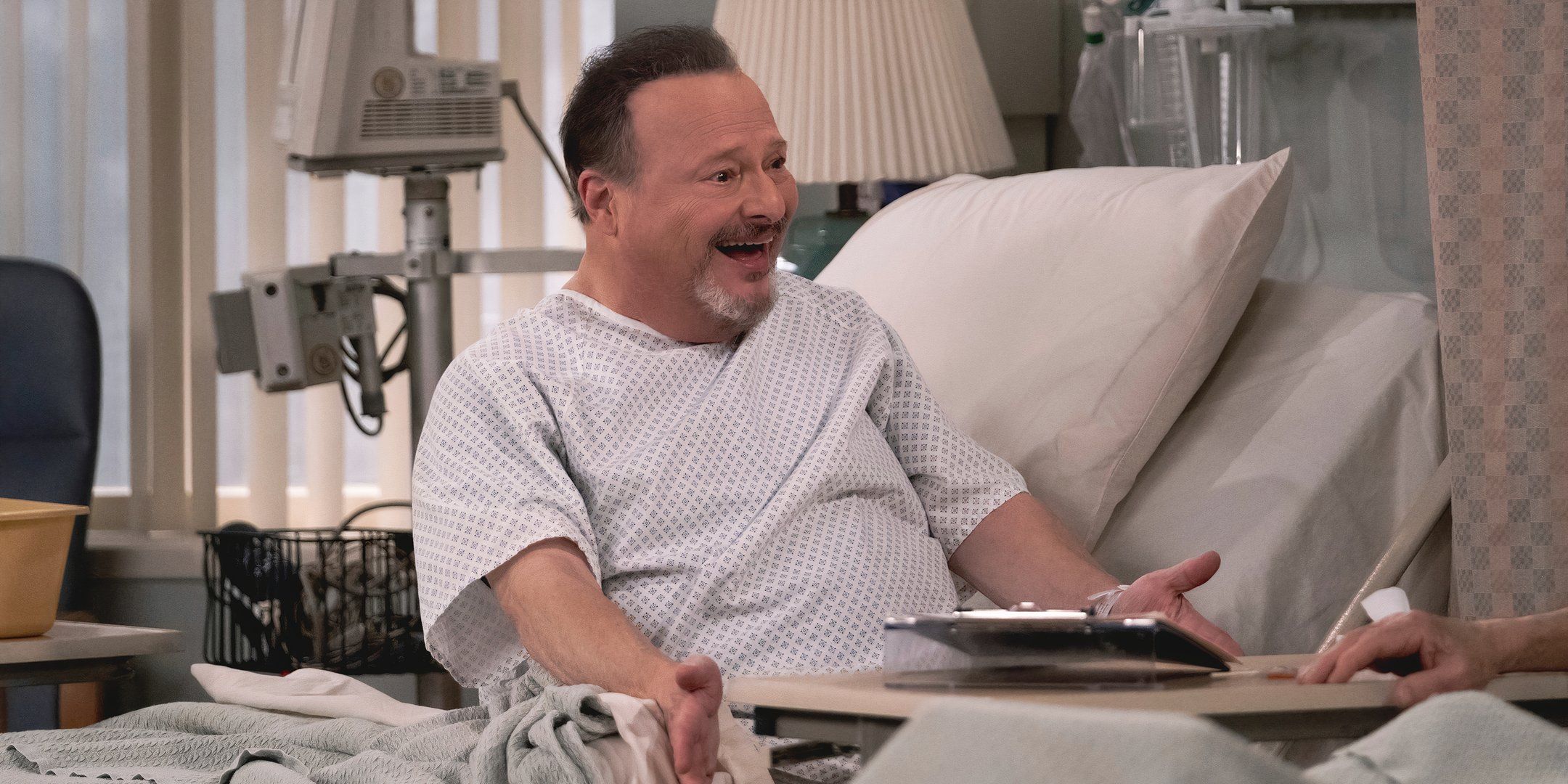 Wayne Knight smiling in the hospital in That '90s Show