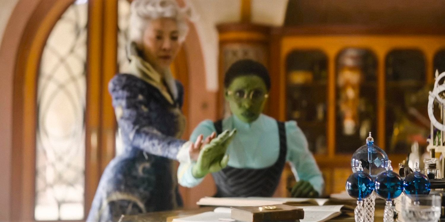 Madame Morrible (Michelle Yeoh) teaches Elphaba (Cynthia Erivo) how to control her powers in Wicked 