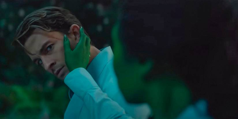 Elphaba tenderly touches Jonathan Bailey as Fiyero's face in Wicked