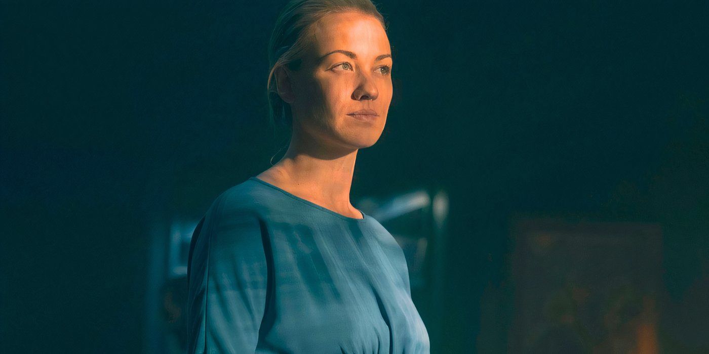 Yvonne Strahovski as Serena Joy looking serious in the shadows in The Handmaid's Tale