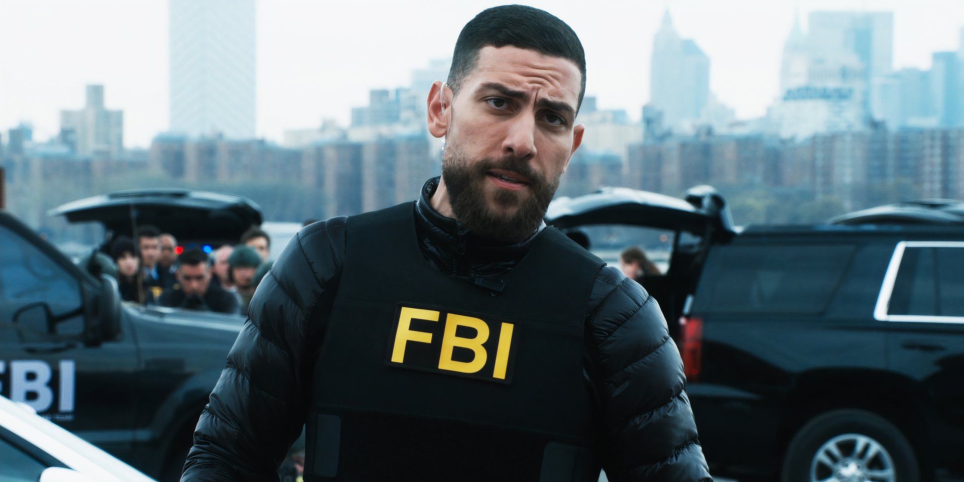 Zeeko Zaki as Agent Zidan with agents ready to shoot behind him in FBI season 6