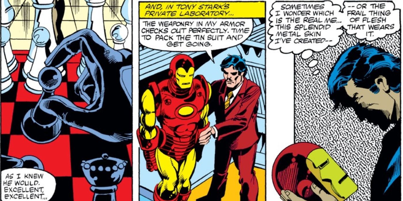 Tony Stark em pé com sua armadura do Homem de Ferro em seu laboratório, segurando seu capacete nas mãos.