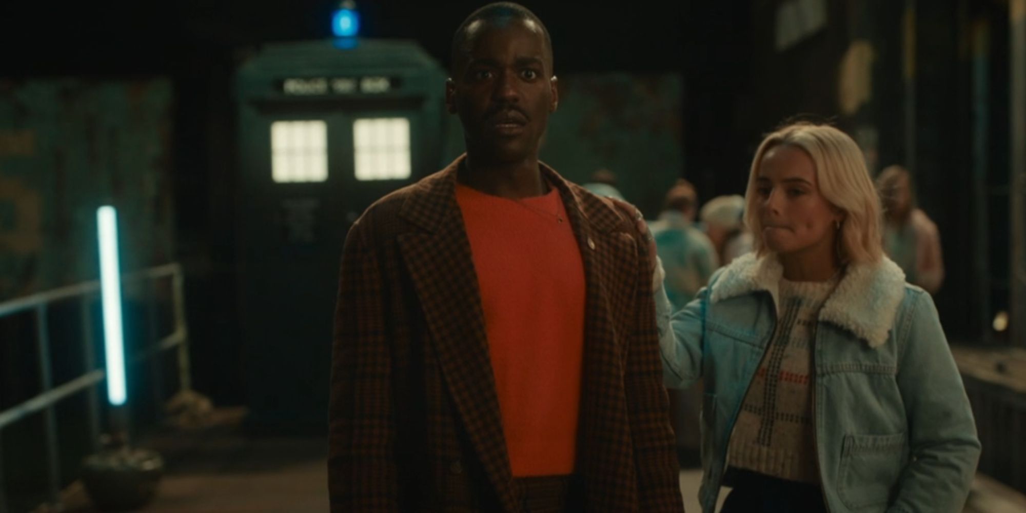 Ncuti Gatwa's Fifteenth Doctor looking stunned in Doctor Who with Millie Gibson's Ruby Sunday resting a supportive hand on his shoulder
