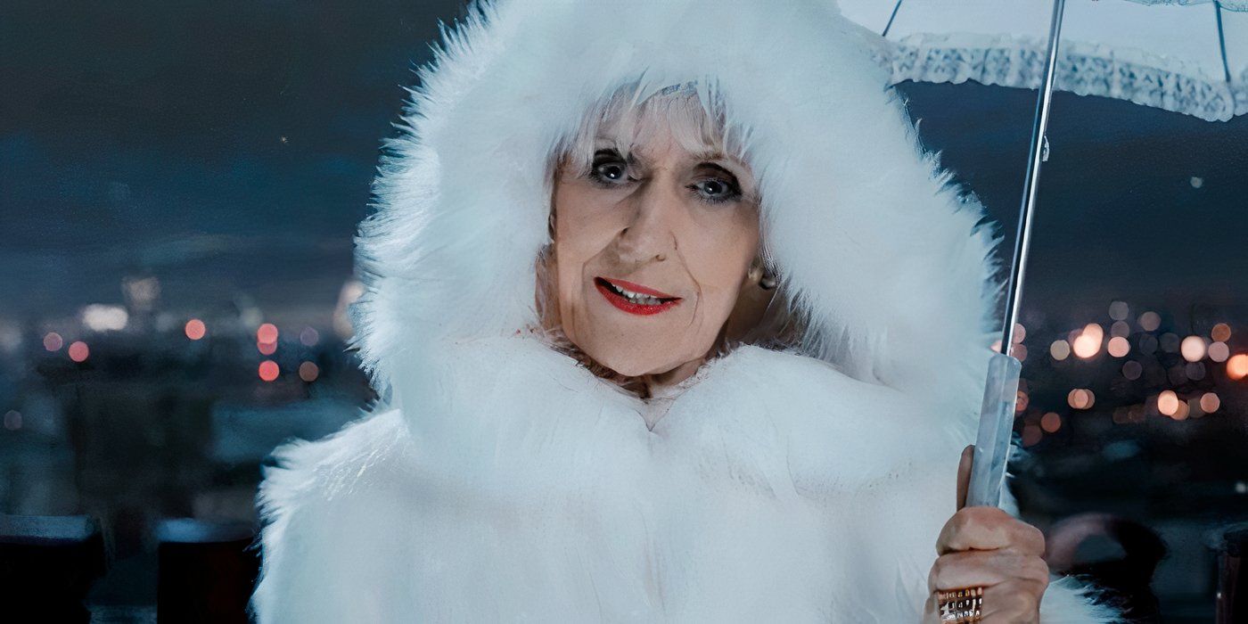 Anita Dobson as Mrs Flood wearing a white coat in Doctor Who.