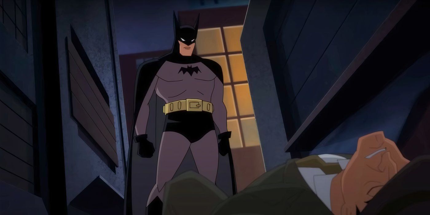 Batman examina um inimigo que acabou de derrotar em Batman Caped Crusader (2024)