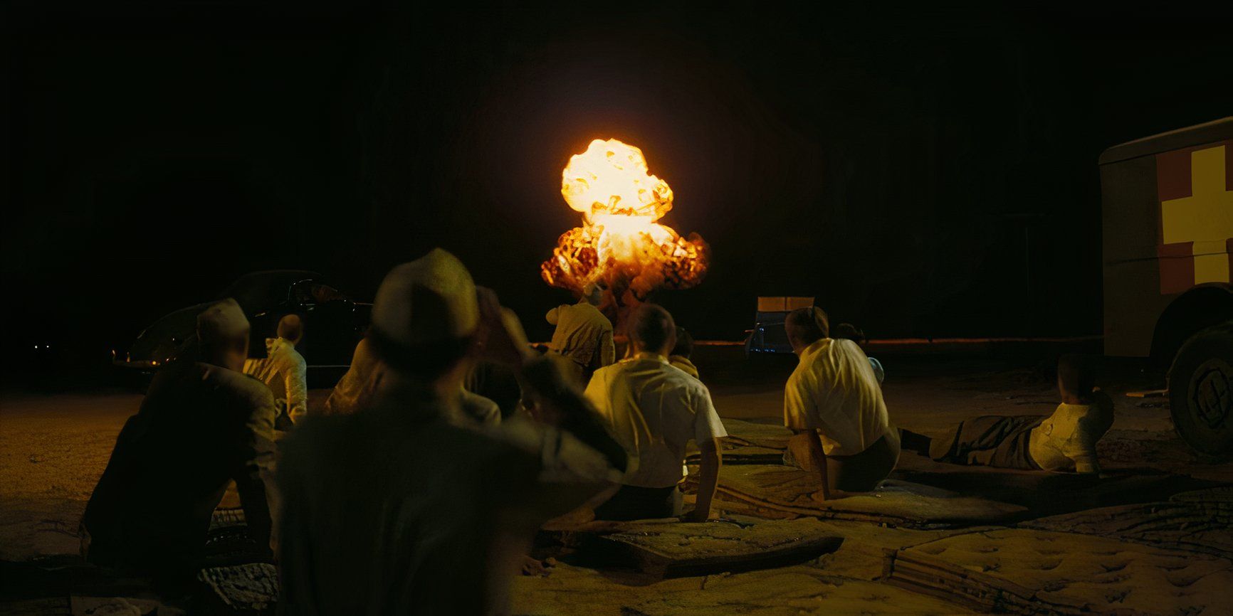 Physicists watching the detonation of the atomic bomb at Los Alamos in Oppenheimer