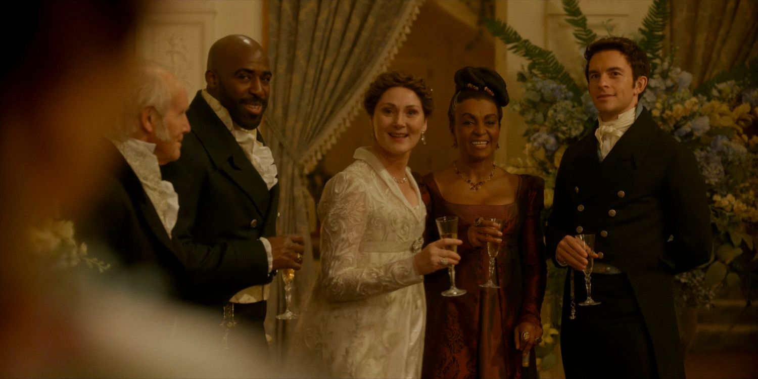 Lord Anderson (Daniel Francis), Lady Violet Bridgerton (Ruth Gemmell), Lady Agatha Danbury (Adjoa Andoh), and Anthony Bridgerton (Jonathan Bailey) smiling at the engagement party in Bridgerton season 3 episode 5