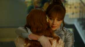 Eloise Bridgerton (Claudia Jessie) looking nostalgic, hugs Penelope in Bridgerton season 3 episode 7