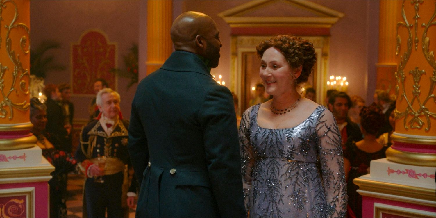 Lord Anderson (Daniel Francis) and Lady Violet Bridgerton (Ruth Gemmell) dancing at the Dankworth-Finch ball in Bridgerton season 3 episode 8