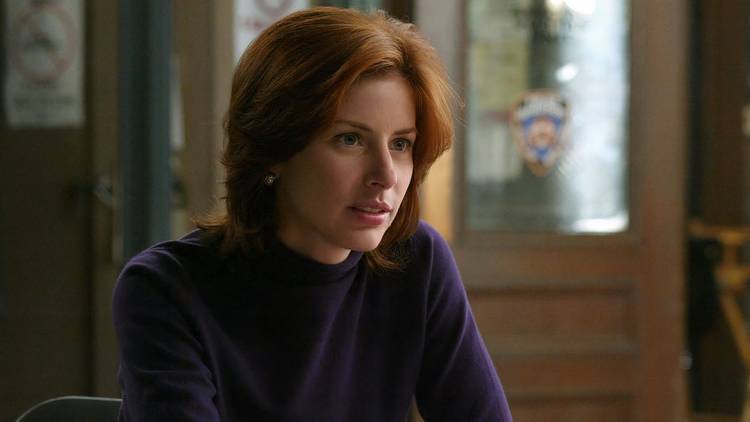 Casey Novak (Diane Neal) sitting at her desk listening in SVU.