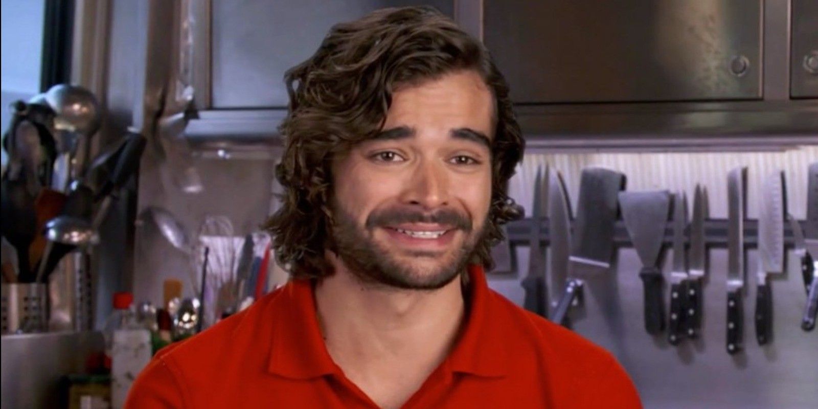 Chef Kiko from Below Deck Med wearing a red uniform in a confessional