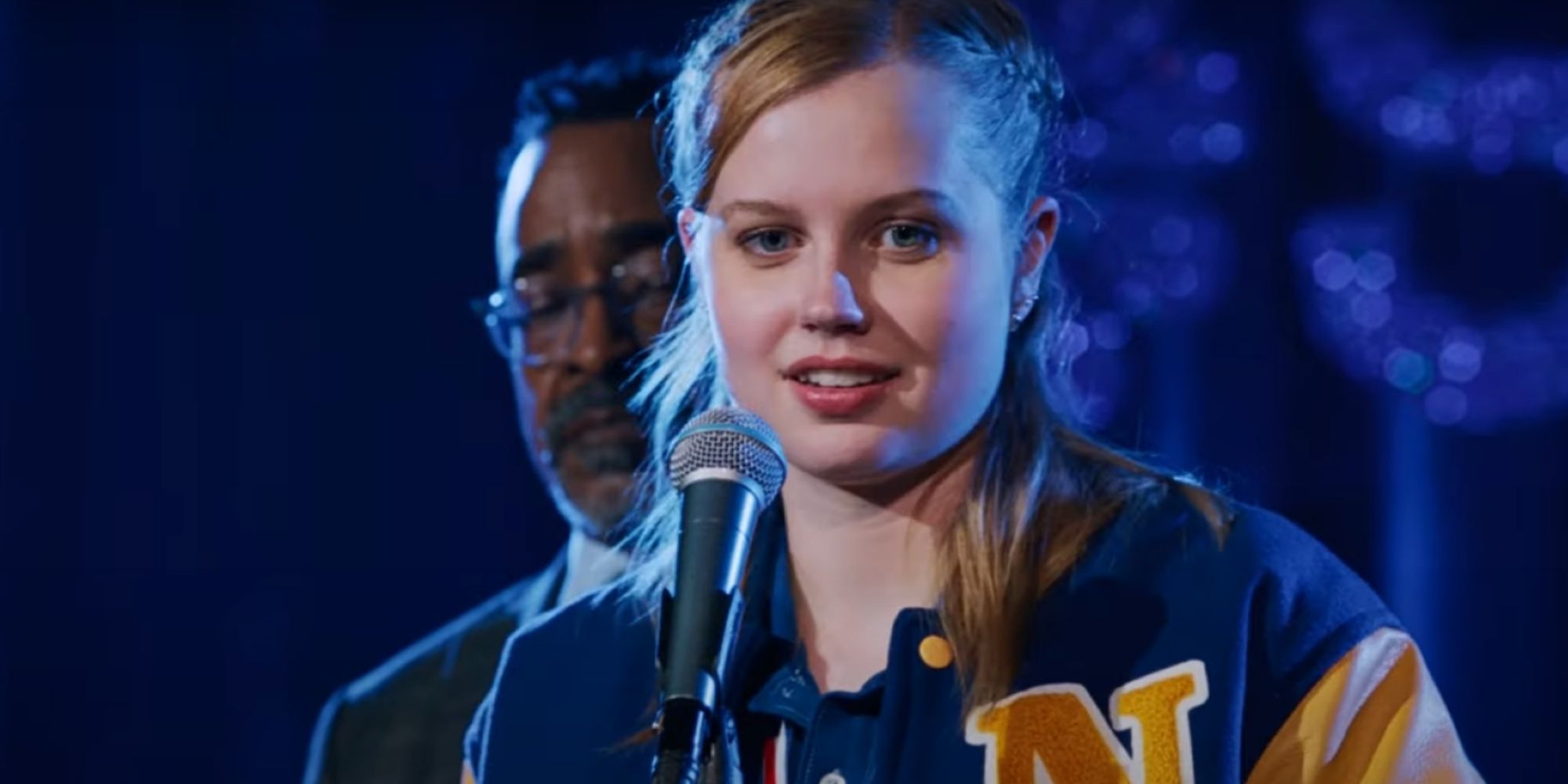 Angourie Rice As Cady Heron Standing In Front Of Mic In Mean Girls 2024.jpg