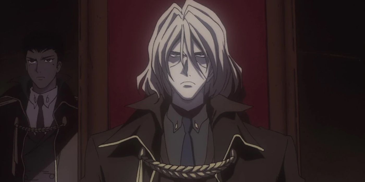 Vicious, a silver-haired man, sits on a throne with an unhappy look on his face.