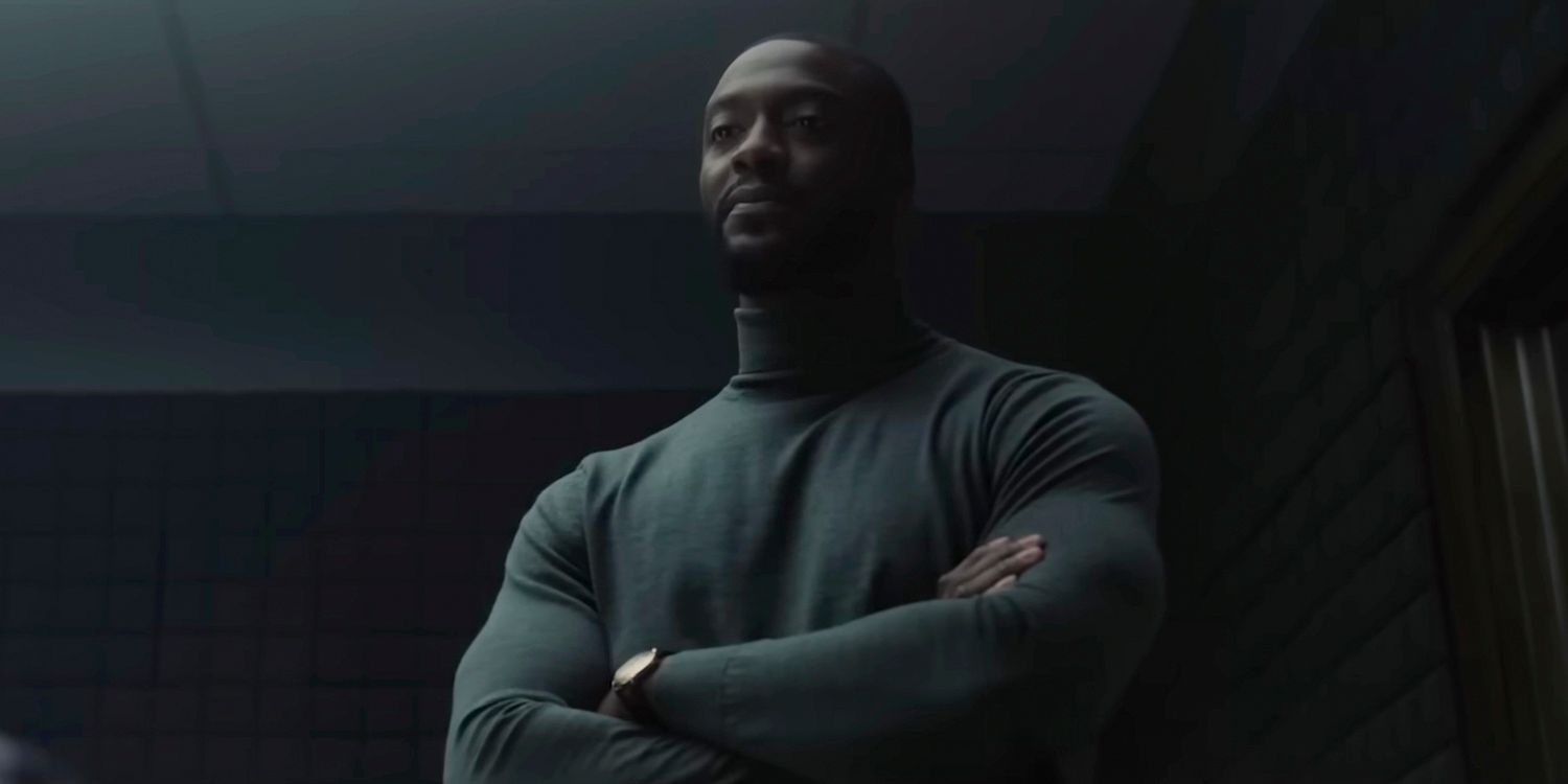 Alex Cross (Aldis Hodge) with his arms crossed and a tough look at the Cross