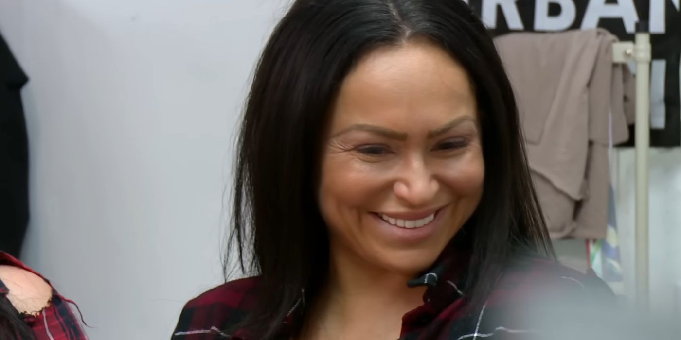 Darcey Silva In 90 Day Fiance smiling in red plaid shirt and long black hair