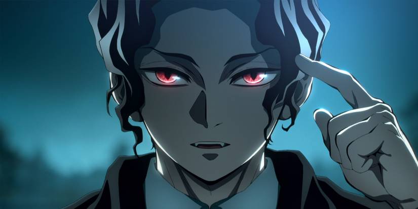 the villainous Muzan points at his own head, his red eyes glowing in the dark of night.