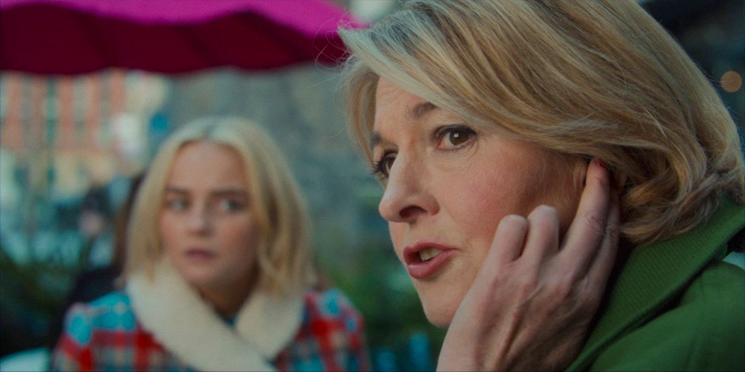 Kate Lethbridge-Stewart (Jemma Redgrave) giving instructions through an earpiece with Ruby in the background in Doctor Who season 14 episode 4