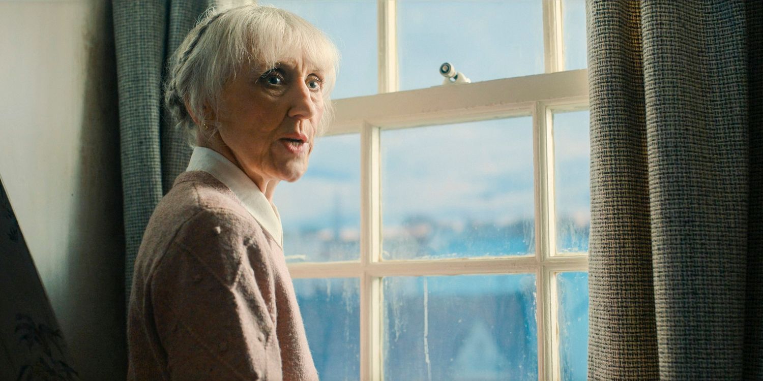 Mrs. Flood (Anita Dobson) worriedly looks out the window as the end draws near in Doctor Who season 14 episode 8