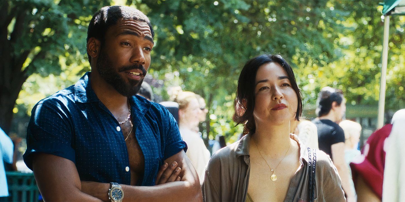Donald Glover and Maya Erskine standing together in a scene from Mr & Mrs Smith