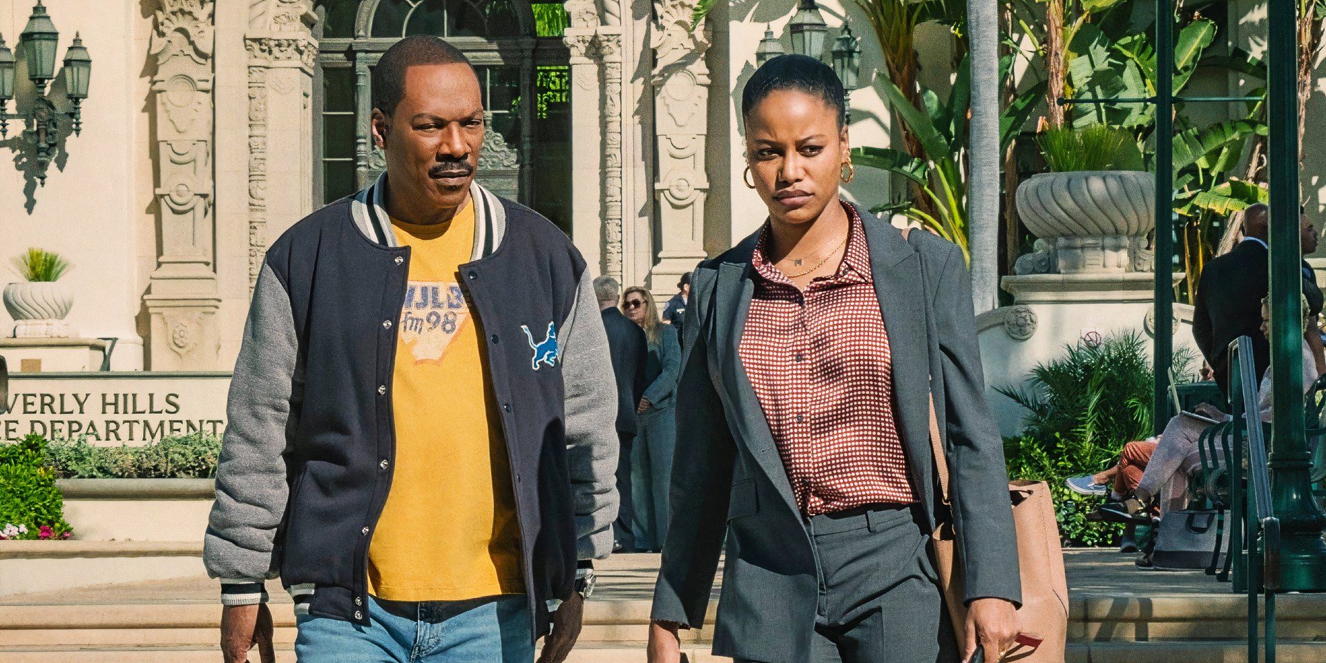 Eddie Murphy walking alongside Taylour Paige outside the Beverly Hills Police Department in Beverly Hills Cop Axel F