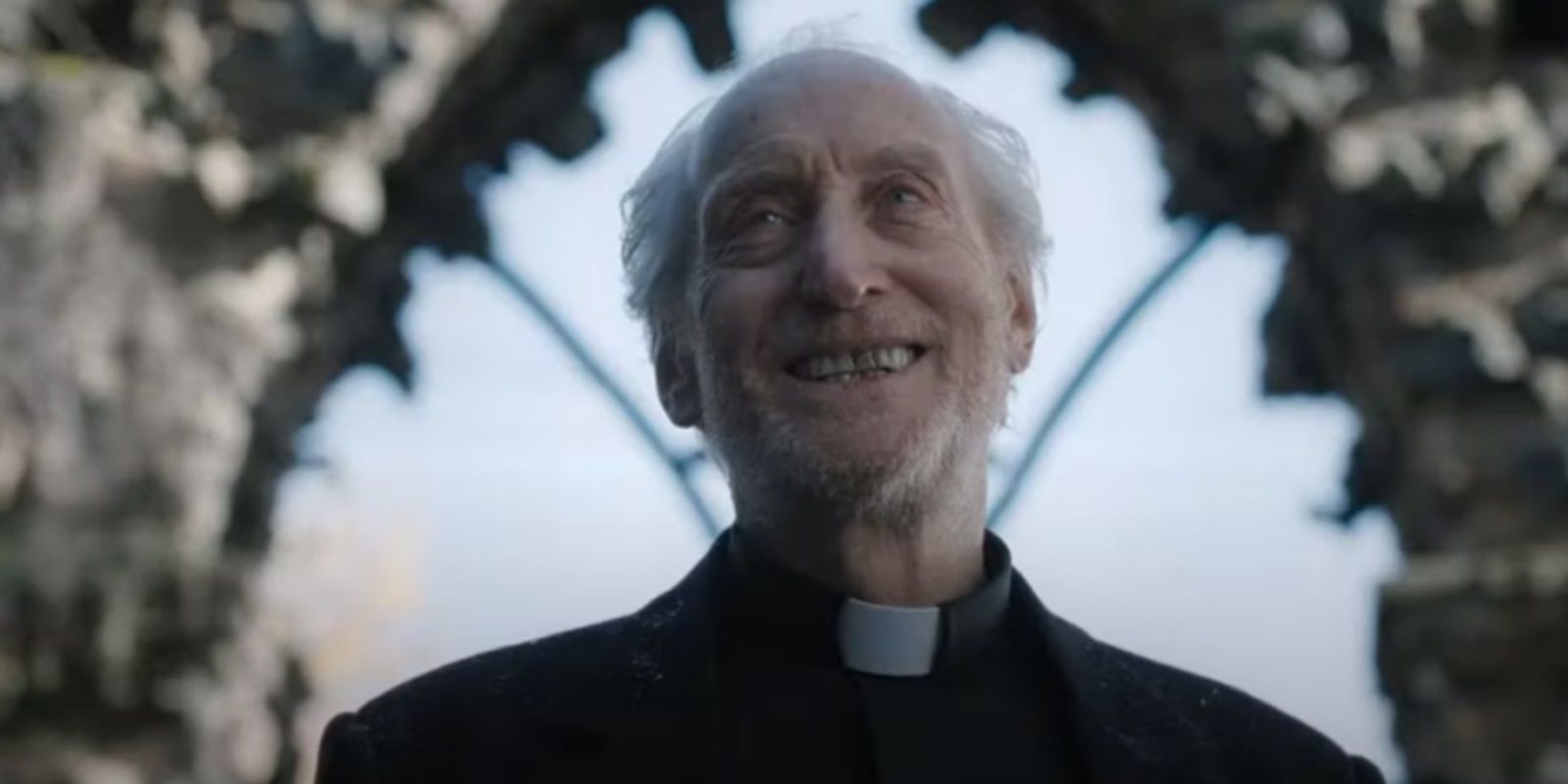 Father Harris smiling in The First Omen