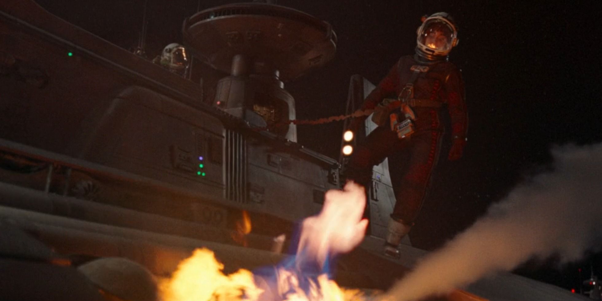 Osha in a space suit looking at a fire in space/on a ship in the first episode of The Acolyte