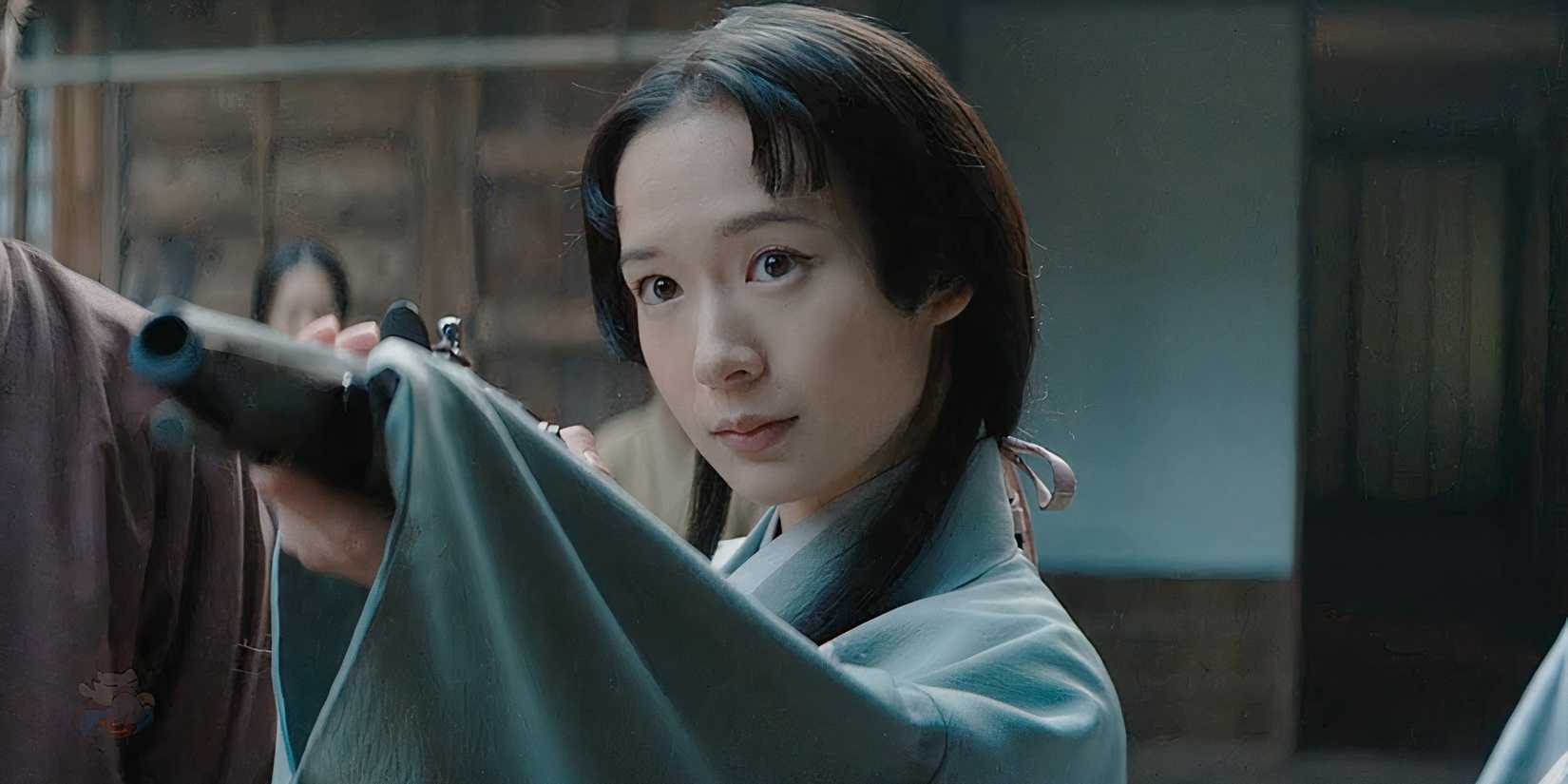 Fuji holding a gun on Omi in Shogun
