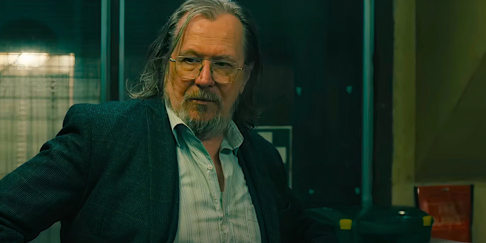 Gary Oldman stands and talks in a scene from Slow Horses season 4